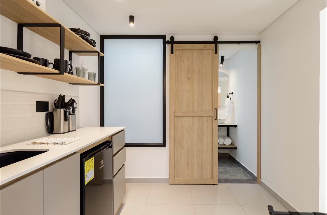 AL202 — kitchen with sliding barn door to bathroom