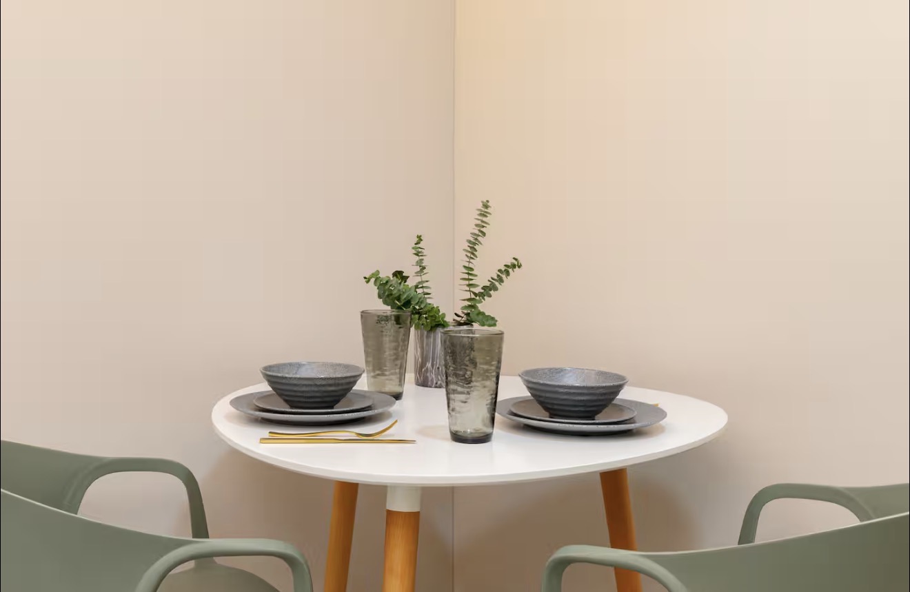 AL202 — dining nook with round table and sage chairs